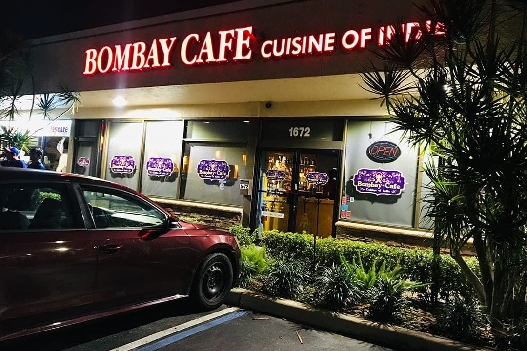 Bombay Cafe at night — Cuisine of India sign